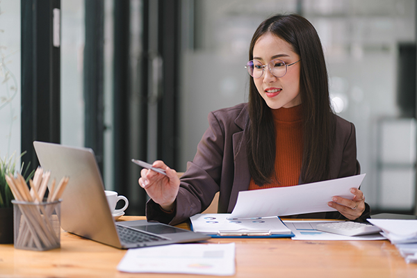 business woman working on tax audit