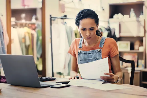 business owner going over payroll and sales taxes