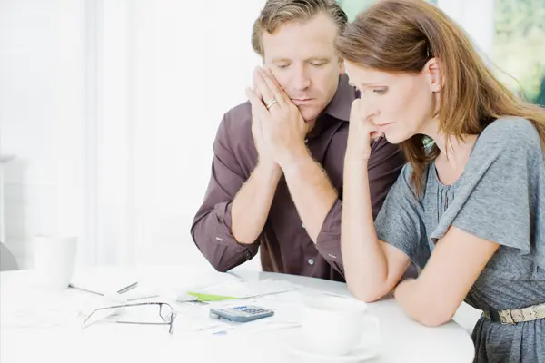 couple overwhelmed by tax debt